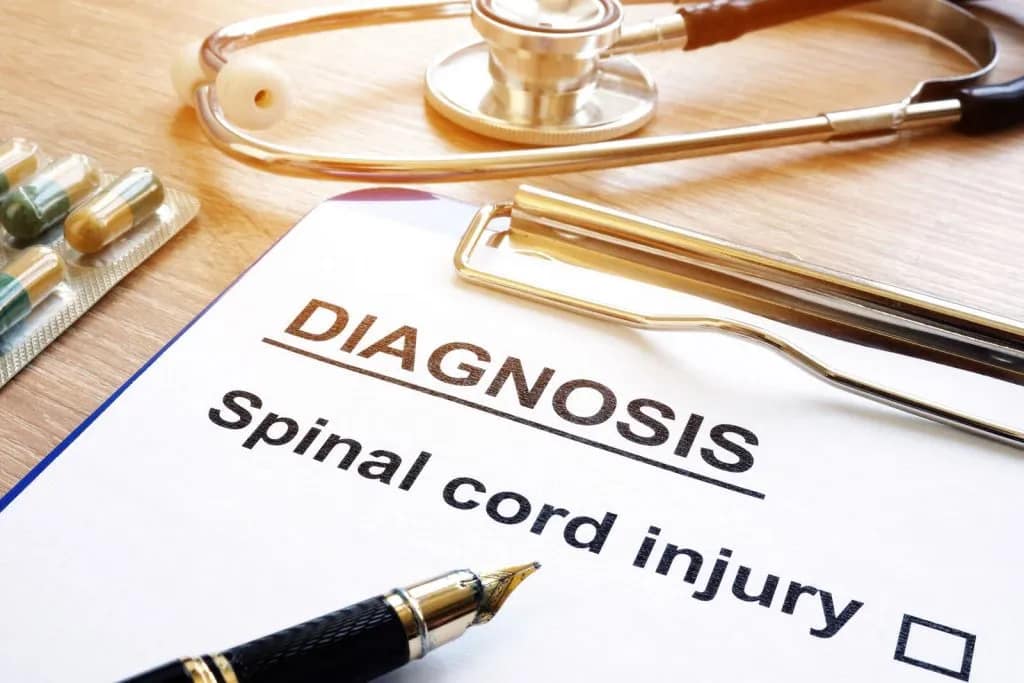 Spinal-Cord-Injury-Diagnosis-on-clipboard-with-medication