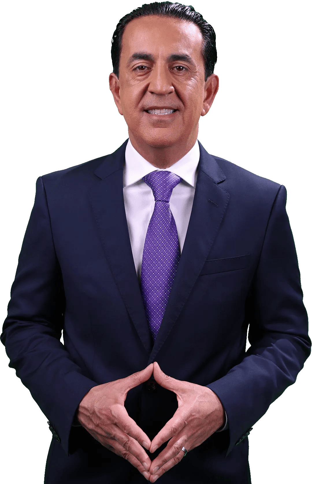 A personal injury attorney in a navy blue suit, white shirt, and purple tie stands smiling with his hands clasped in front of him against a plain, light background.