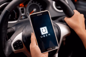 driver using Uber app on phone